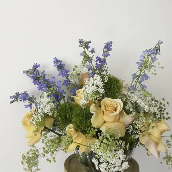 An elegant and sophisticated bouquet of flowers, including Delphinium and Garden Roses, for sale at our Washington, NC, florist.
